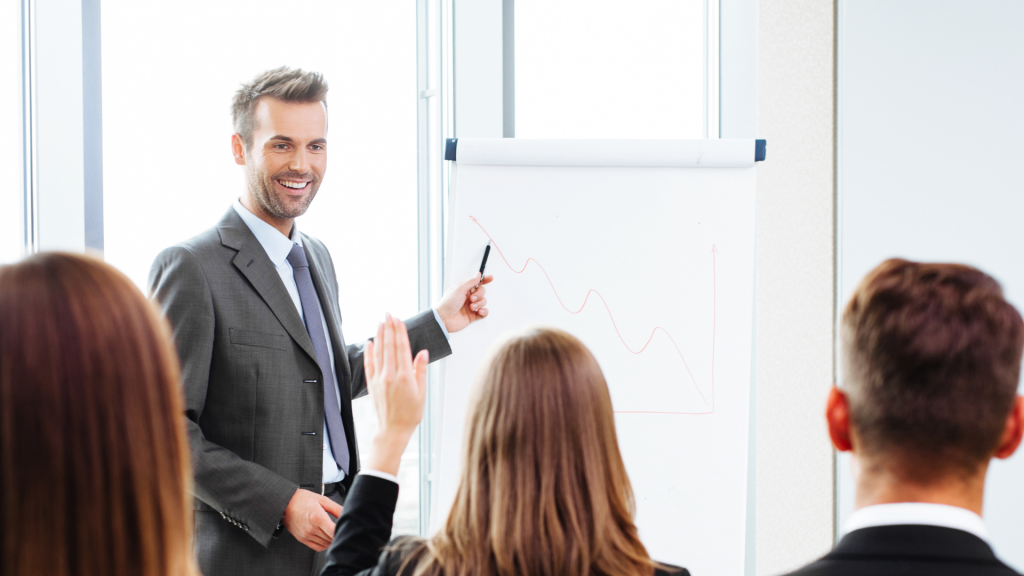 A Telefocal training instructor teaching telecom professionals in a classroom setting