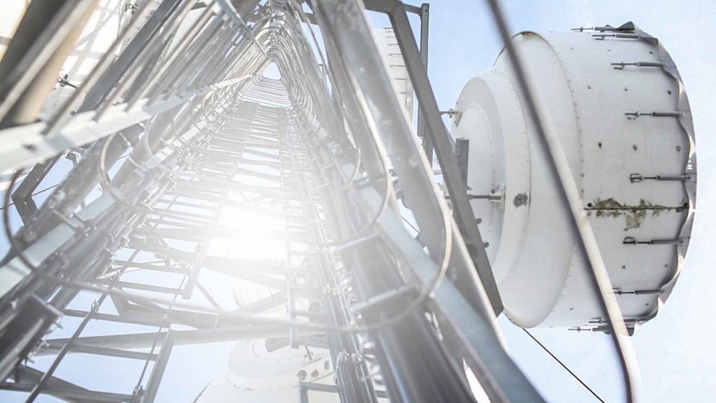 Microwave transmitter antenna on communication tower base station